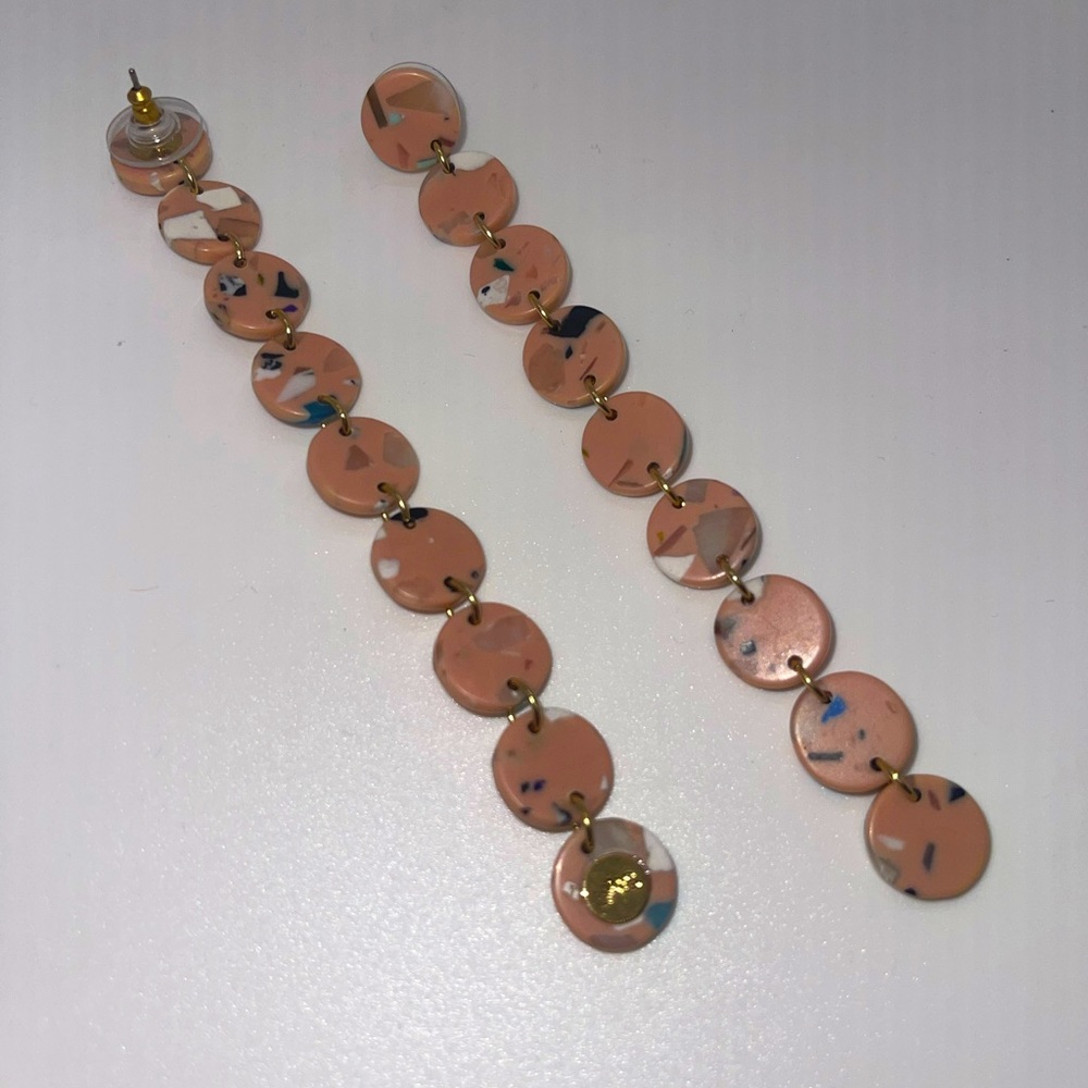 Lele Sadoughi mauve/soft terrazzo-ish drop disc linear earrings.